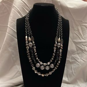 Black, silver, and chrome beaded necklace.